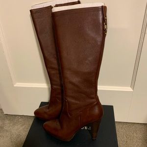 Knee-high platform leather boots with brass buckle